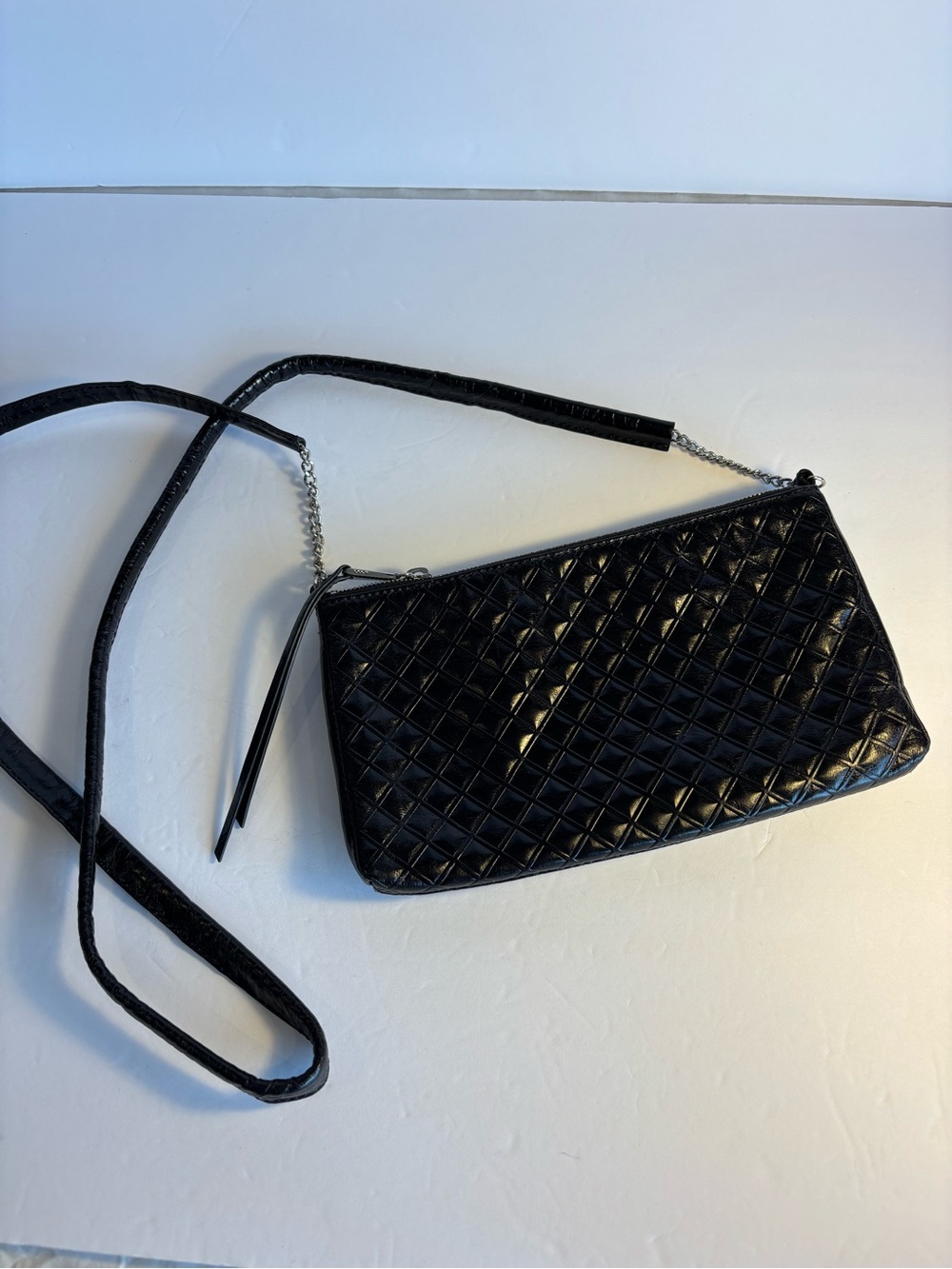Hobo black quilted crossbody with chain elements.